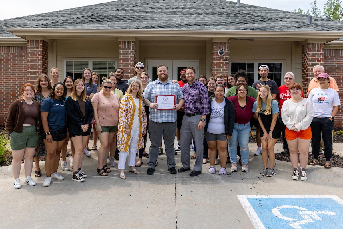 Marshall Kole (center) is the Associate Director of Residence Life