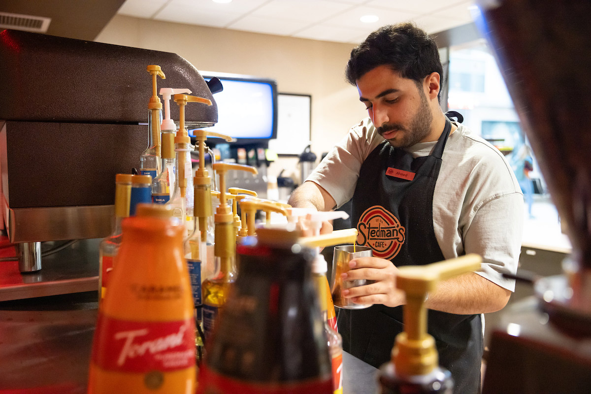 Ahmed Al Waili pours an espresso shot from the Stedman's espresso machine.