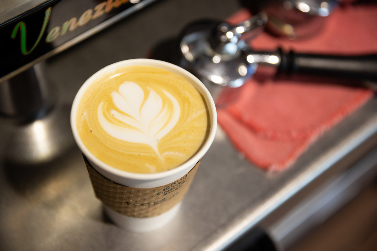 A barista at Stedman's shows off their skills with latte art.