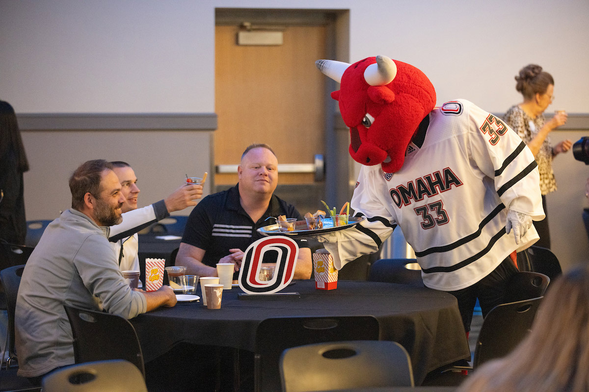 Durango serving guests at the reception following the address.