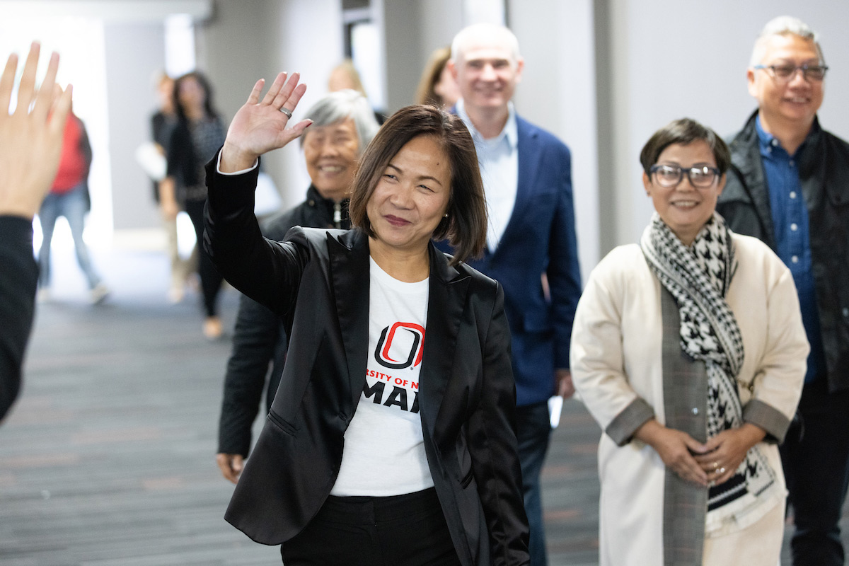 Chancellor Joanne Li, Ph.D., CFA, and guests walk into the reception following the State of the University Address.