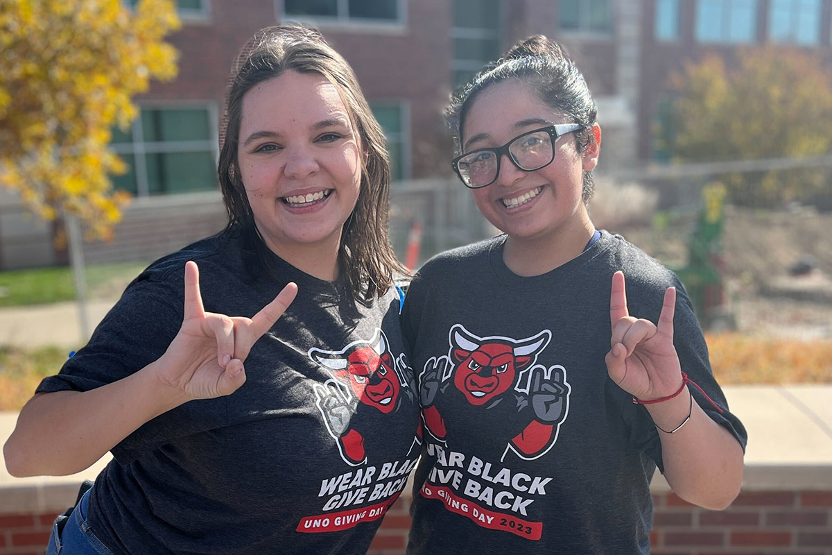 Maverick Maniacs members Lisa Grabowski and Lucia Revello show their support for UNO during Wear Black, Give Back on Nov. 8, 2023.