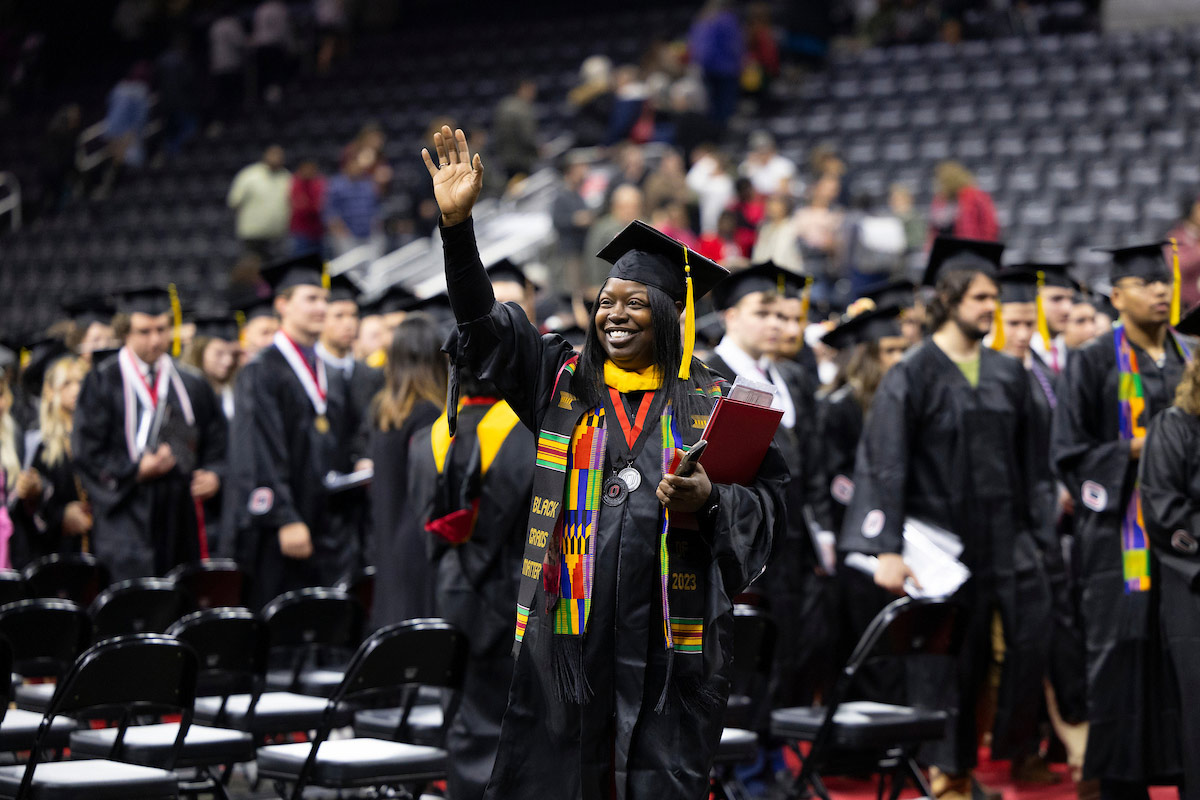 A student celebrates after graduating from UNO.