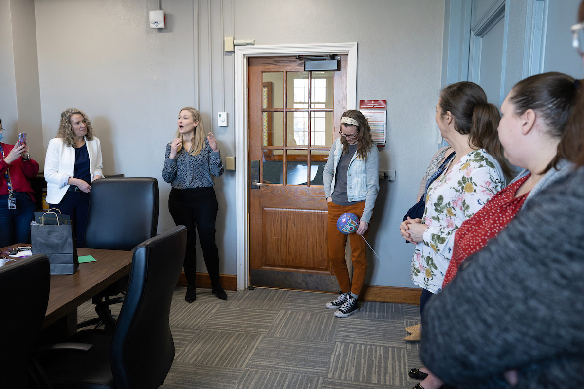 Katie celebrates with her colleagues