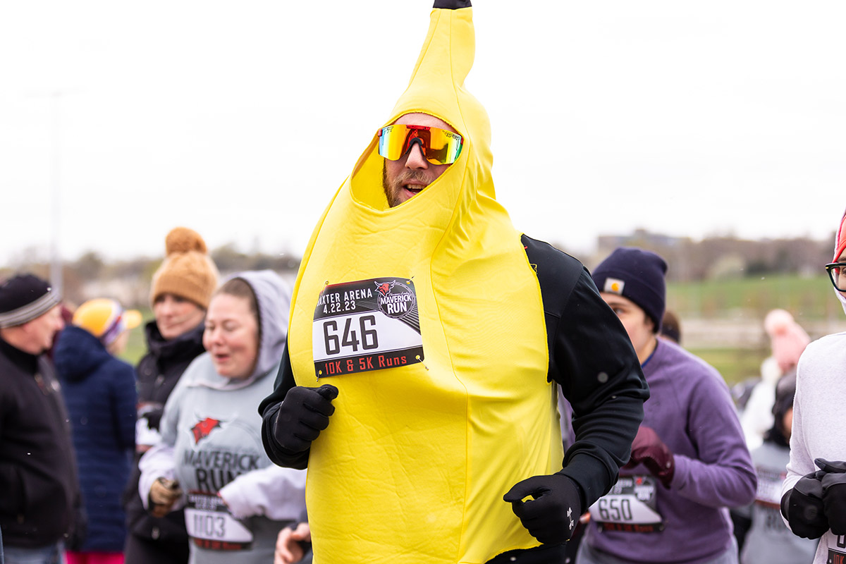 A person in a banana costume runs in Claussen-Leahy Maverick Run.