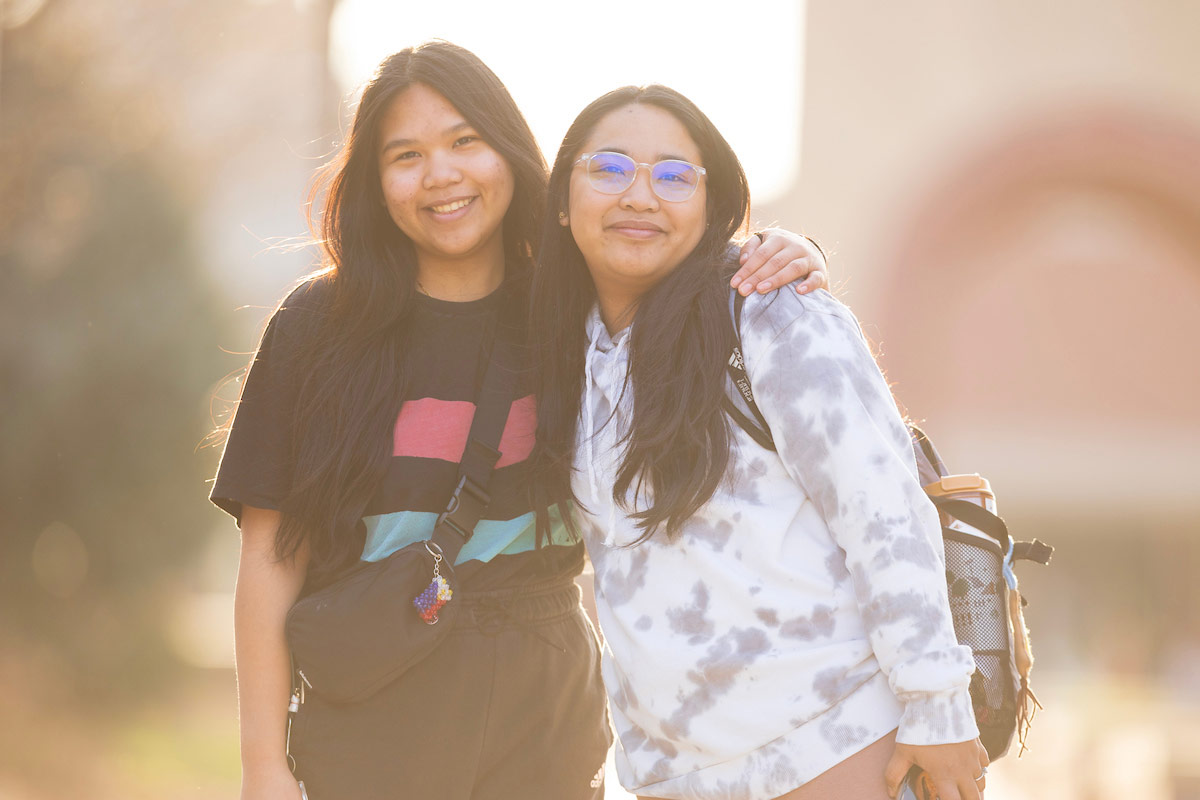 Mary Odette Palafox, right, a UNO biology major, and her younger sister, Mary Jemarice Palafox, a UNO computer science major, walk through the University of Nebraska at Omaha’s Dodge Campus. 