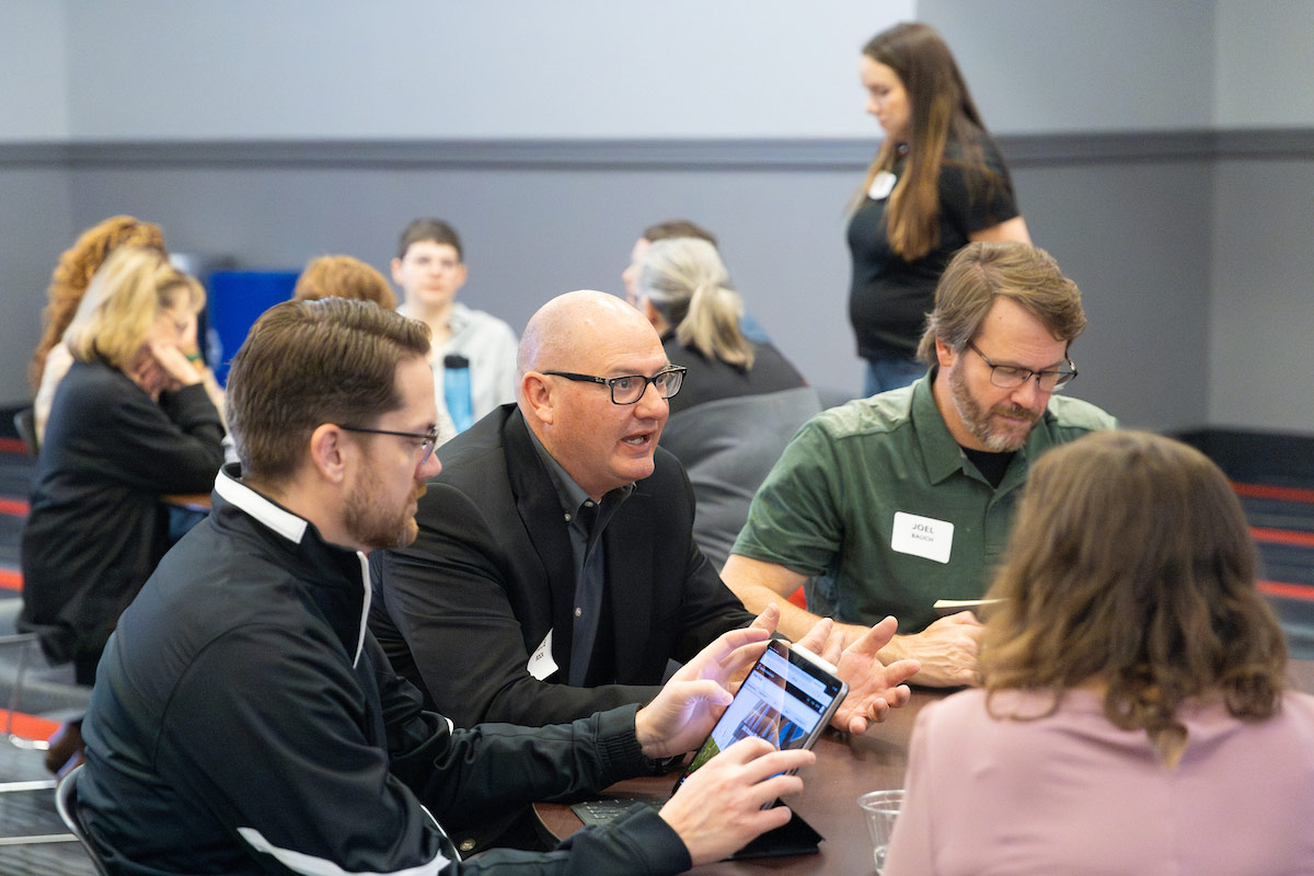 Attendees discuss the UNO Core and offer feedback.