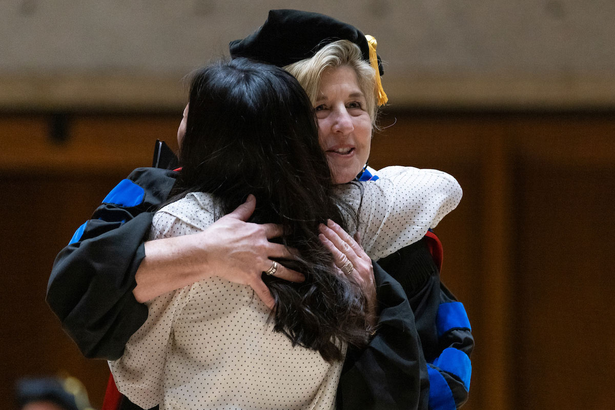 CBA Dean Michelle Trawick, Ph.D., congratulates a student.