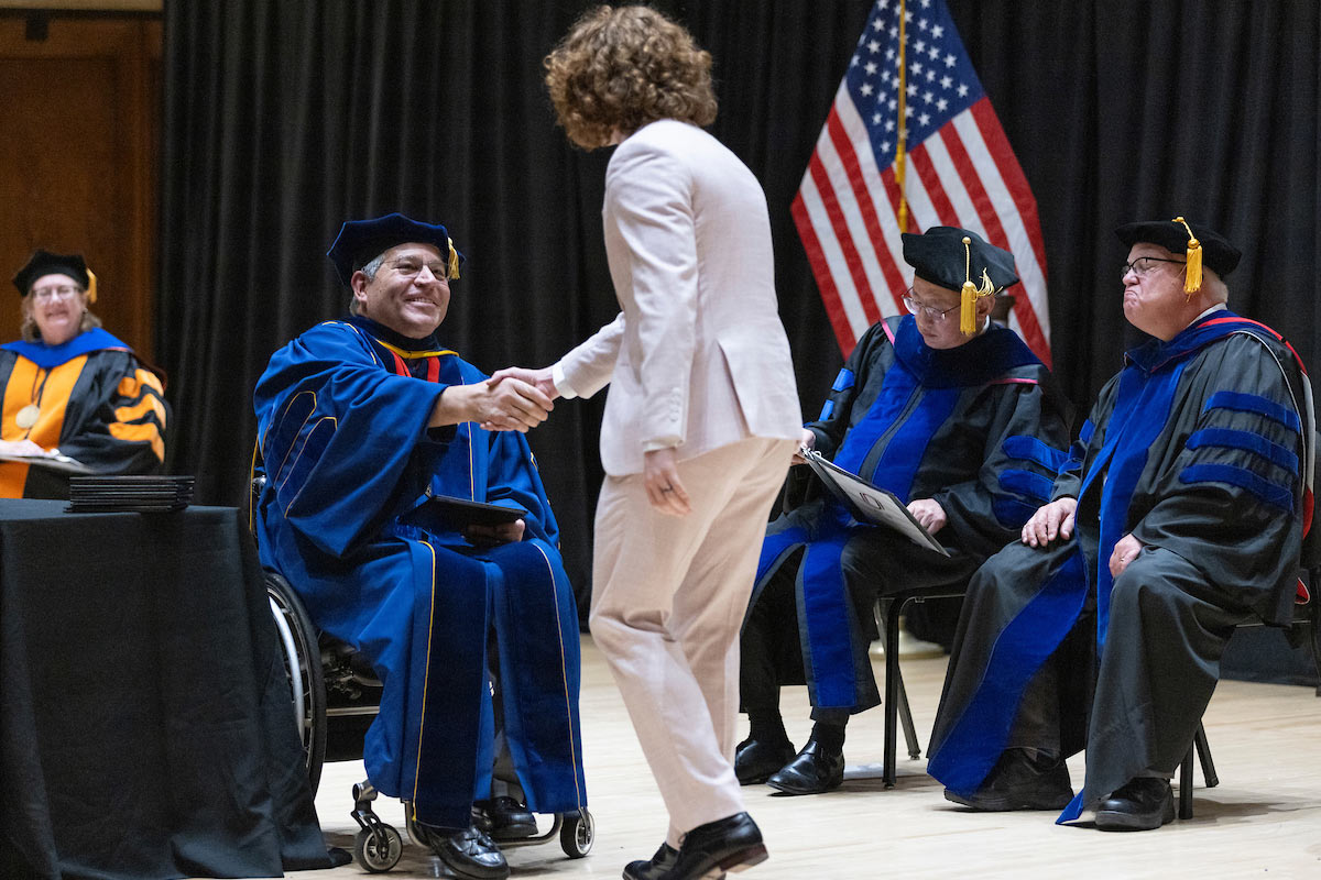 A student receives an award.