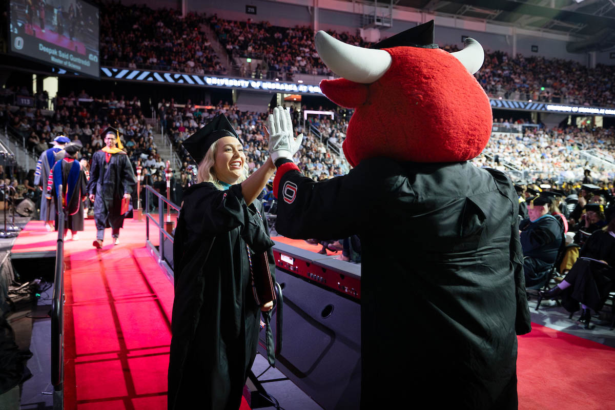 Durango gives a new alum a high five.