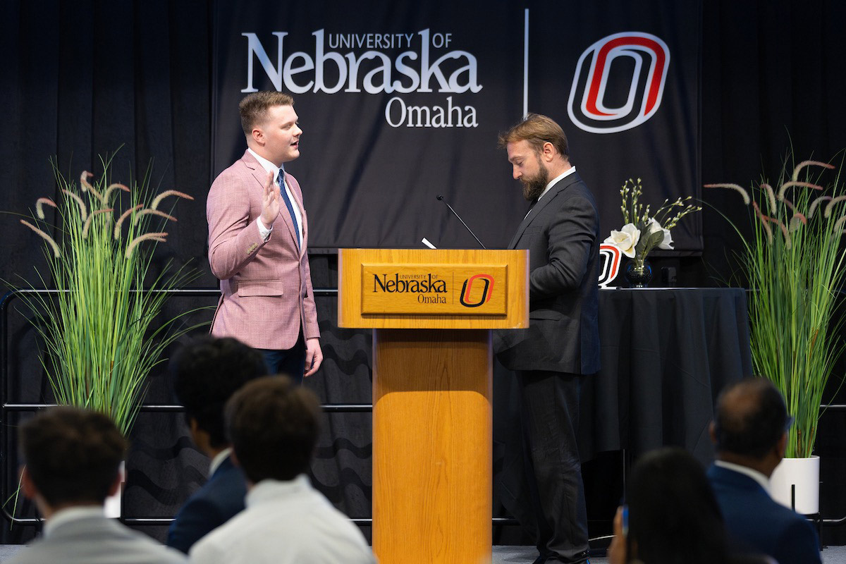 Drew Leisy, a business administration major from Bridgeport, Nebraska, is sworn in as the University of Nebraska at Omaha’s new student body president and student regent.