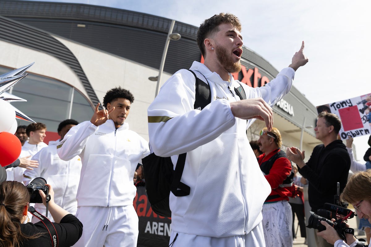  University of Nebraska at Omaha fans cheer on the UNO men’s basketball team as they load the bus as they make their way to the NCAA basketball tournament 