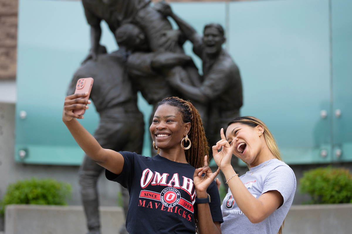 UNO Social Media Ambassadors Miracle Olawuyi (left) and Lana Huetson (right) in downtown Omaha, Nebraska.