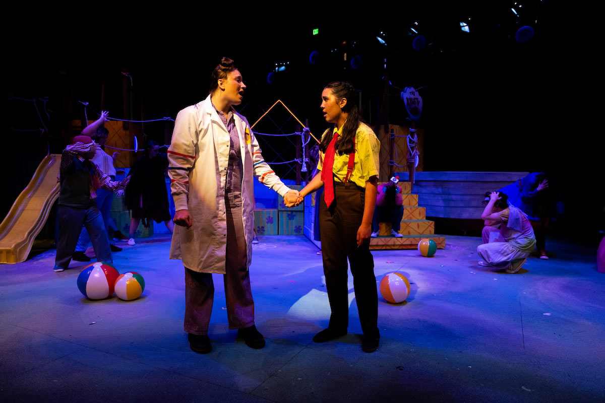 High school students perform a colorful scene from The SpongeBob Musical on stage at UNO’s Black Box Theater.