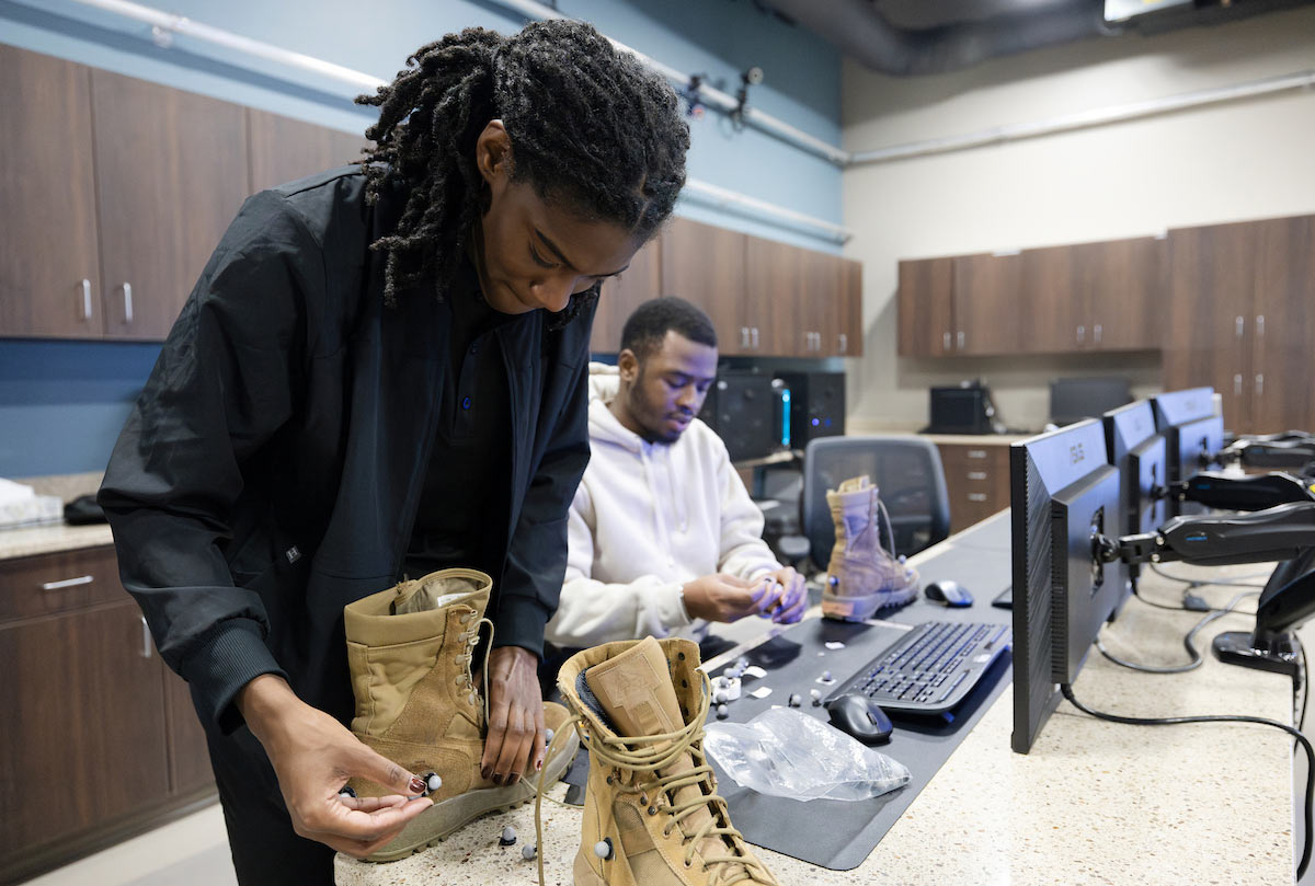 UNO students assist with testing a FlyBand® ExoBoot prototype at the University of Nebraska at Omaha Biomechanics Research Building. 
