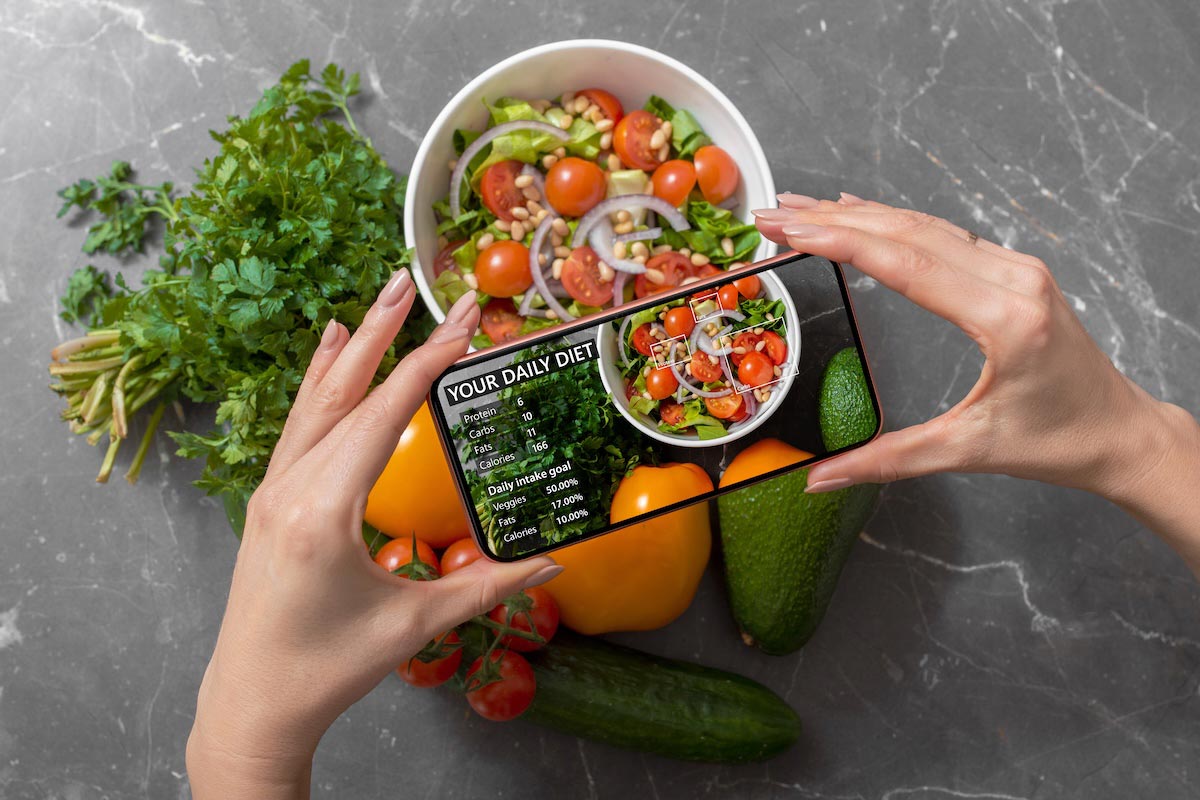 Person using smartphone to track nutrition facts and calories in her food.