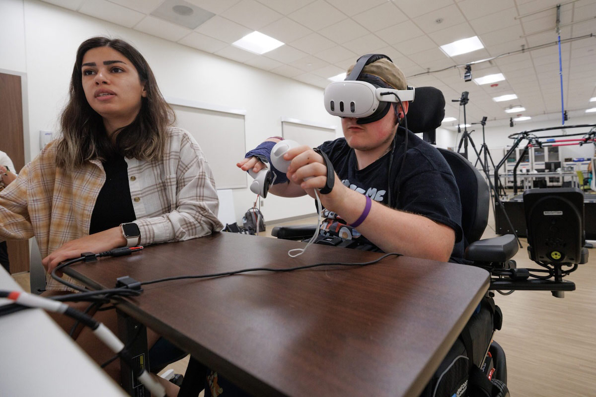 Connor Strobel plays a virtual reality game during HABIT camp at the Munroe-Meyer Institute. The camp is designed to allow children with cerebral palsy and other conditions to work on using both hands to complete a task in the form of play.