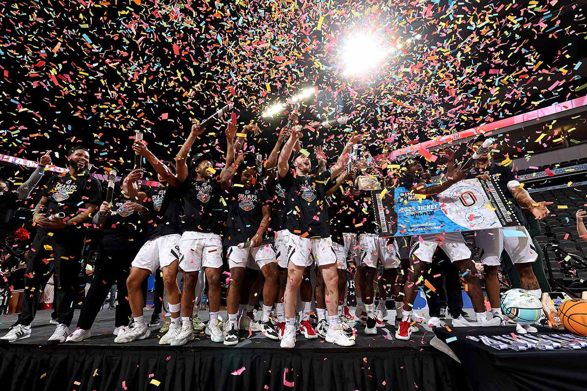 The Omaha Men's Basketball team is showered in confetti as they earn a trip to March Madness.