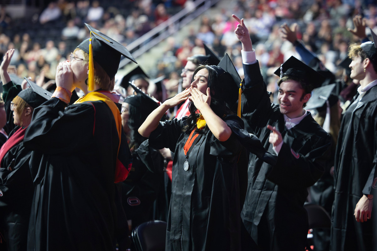 Cheering UNO graduates.