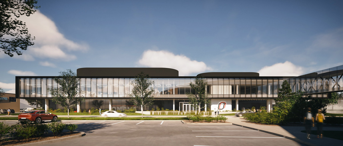 Modern architectural rendering of the exterior of the multi-story building featuring large glass windows and landscaped surroundings.