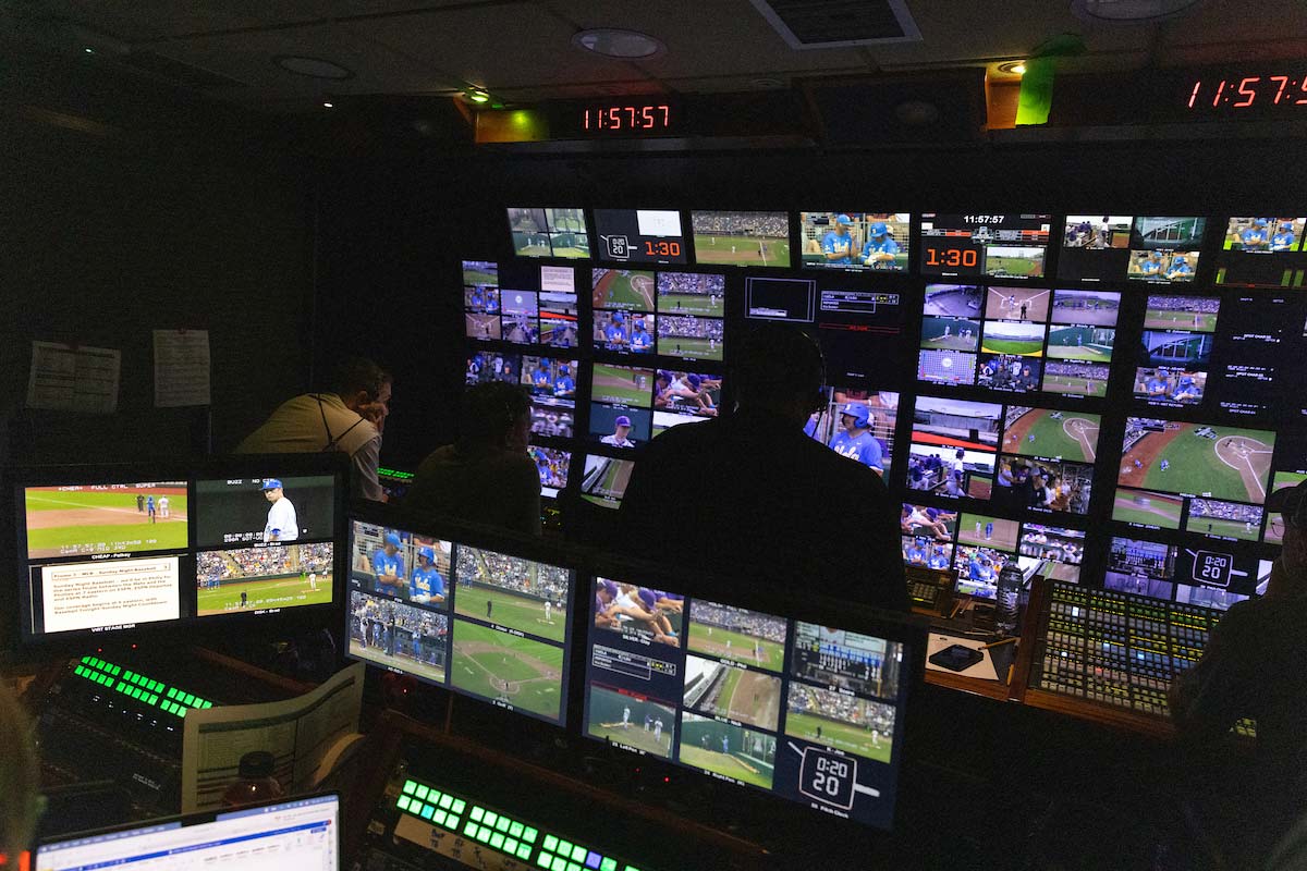 UNO students and faculty explore ESPN's production trucks during the Men's College World Series, learning about the technology and teamwork behind live sports broadcasts. Photo: Jeremy Chretien, Office of Strategic Marketing and Communication. 