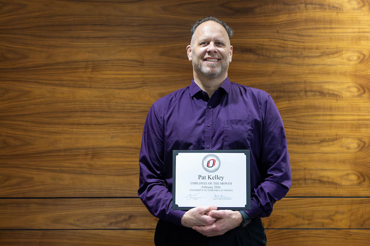 Pat Kelley poses with his Employee of the Month certificate.