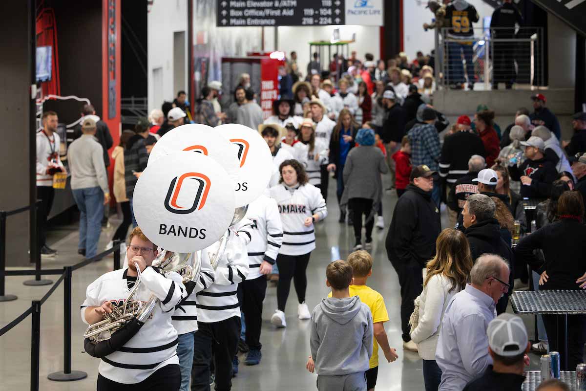 Spirit band tuba parade processes through Baxter Arena.  