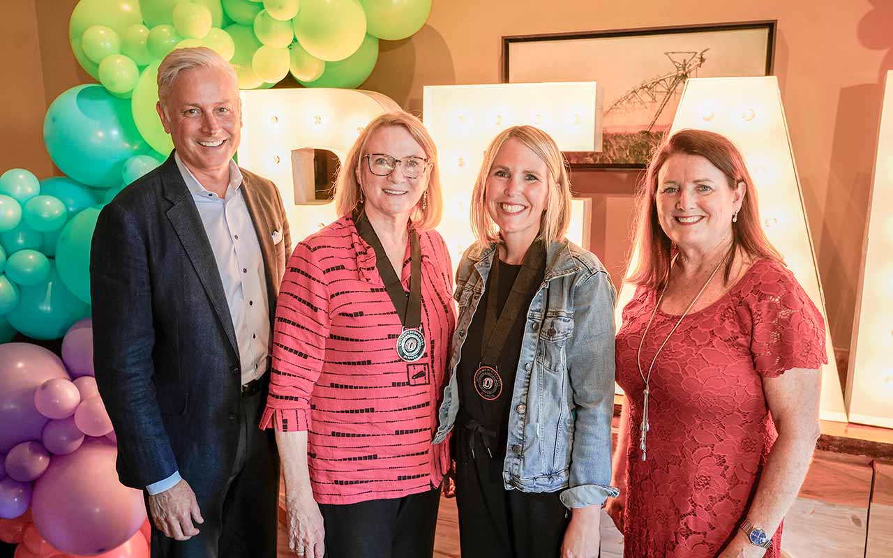 Lemke poses with Lozier Foundation representatives Tre Brashear, Dianne Lozier, and Susan Toohey during a celebration recognizing her as the inaugural recipient of the Lozier Endowed Presidential Chair of Literacy.