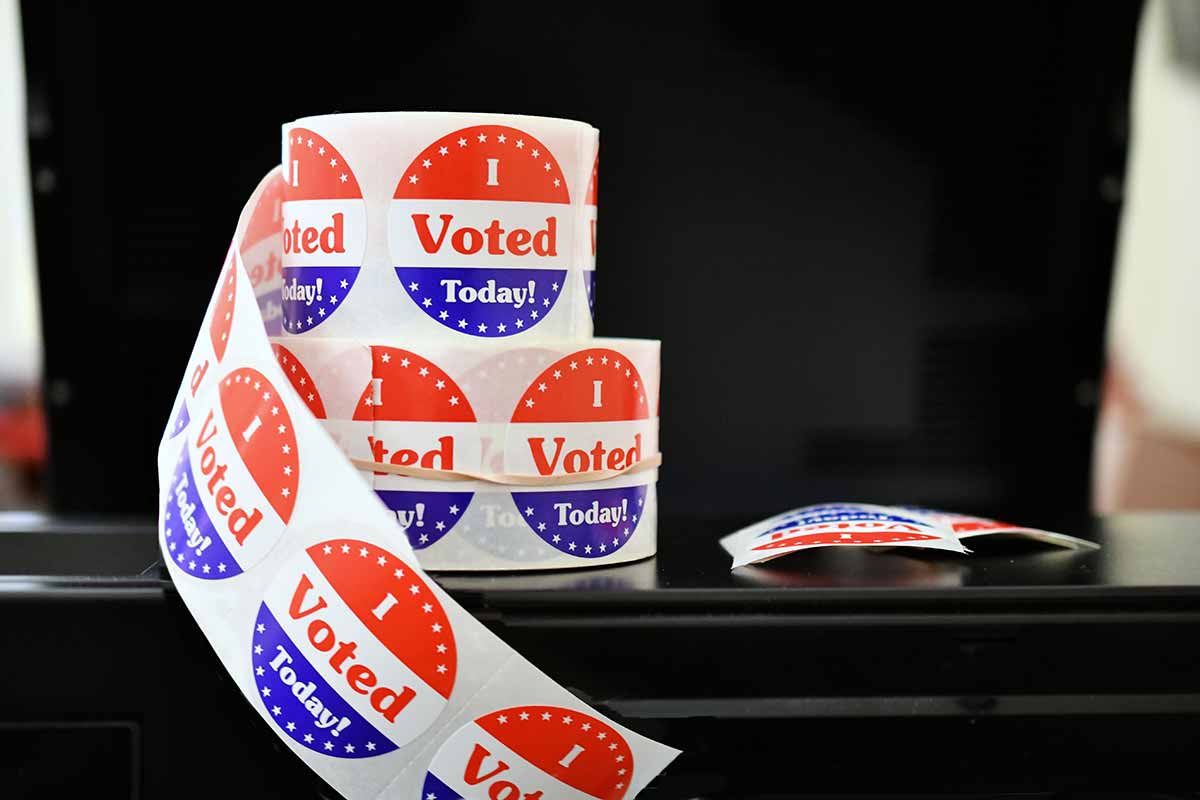 roll of "I VOTED" stickers on a table