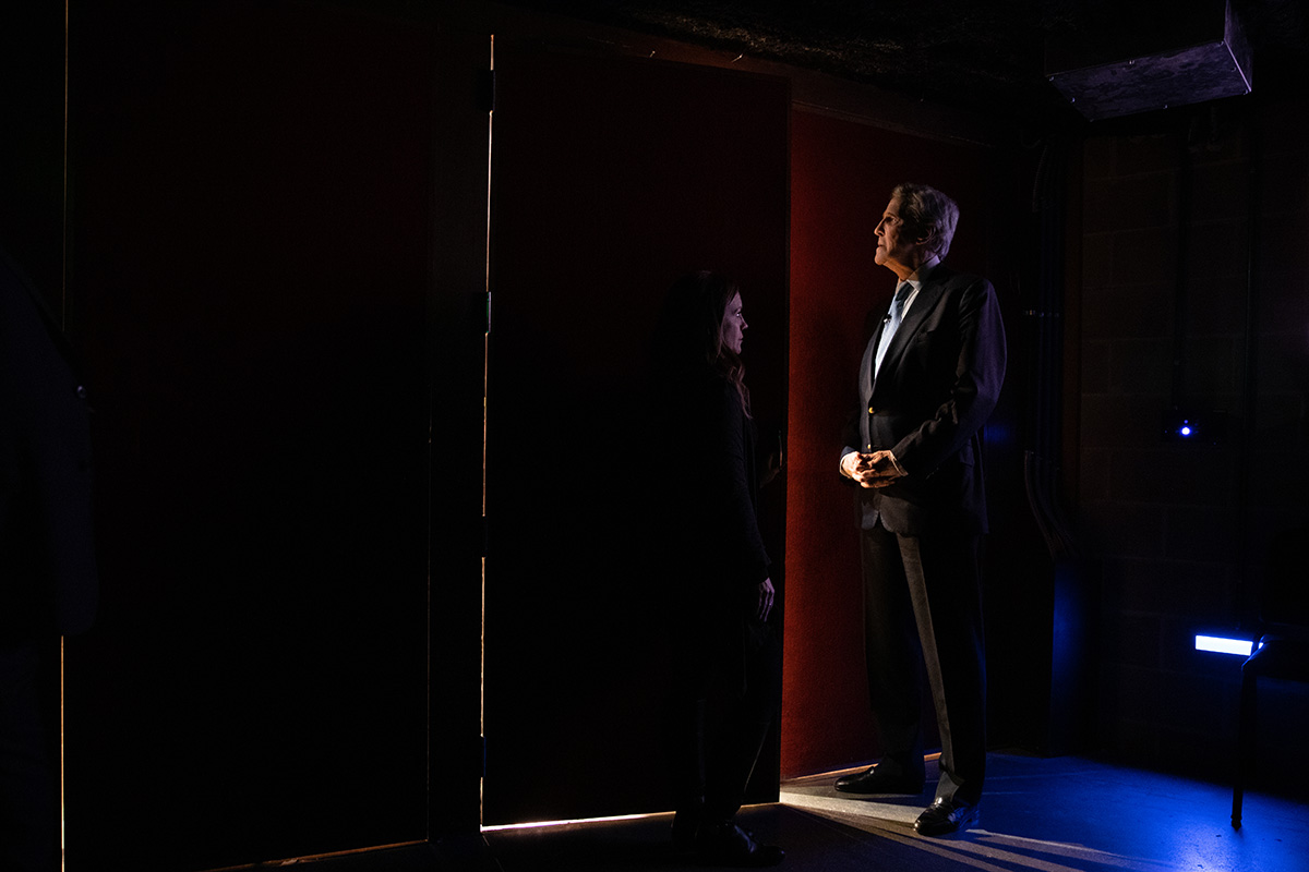 John Kerry stands backstage at the Strauss Performing Arts Center