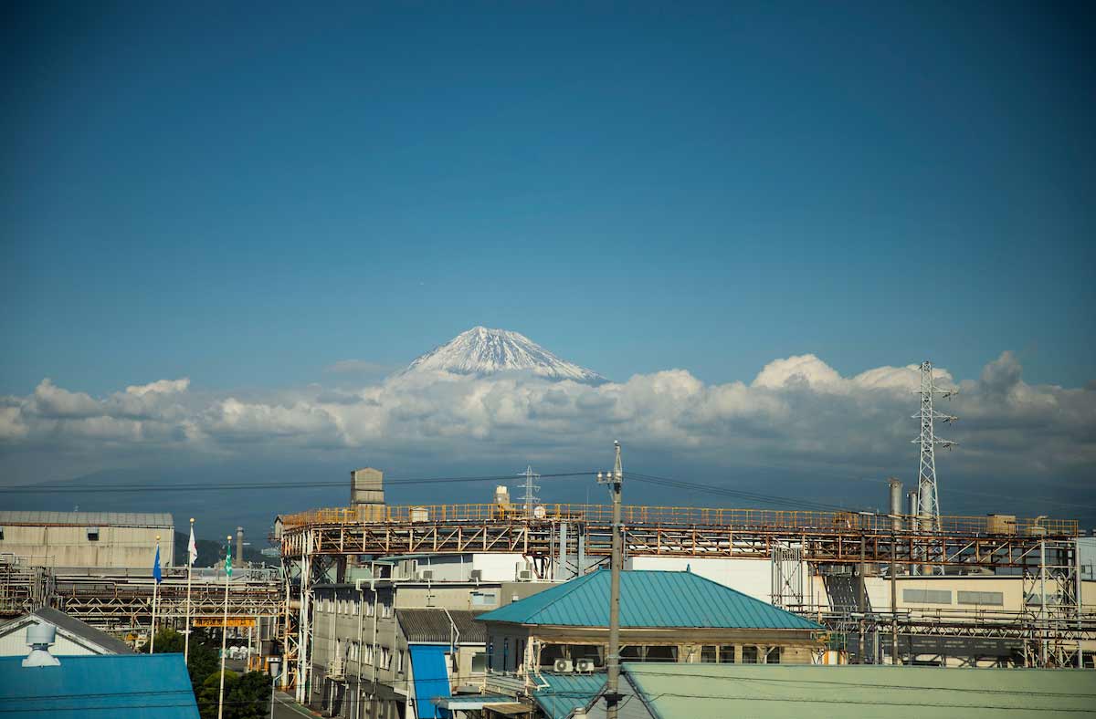 The clouds break over Mount Fuji on a view from the train between Hamamatsu and Shizuoka, Japan