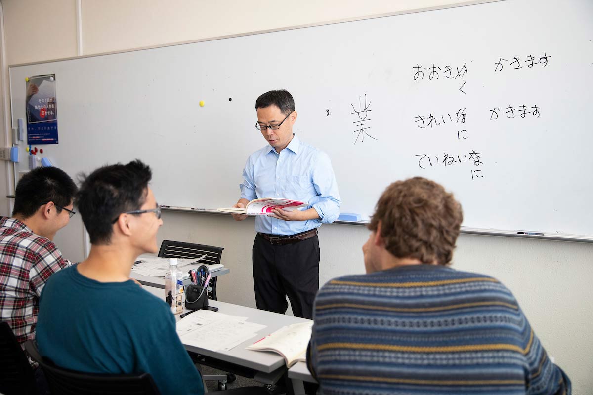 A photo of UNO students Lucas Kolb and Connor Smith, from behind, as they take part in a Japanese language lesson at Shizuoka University.