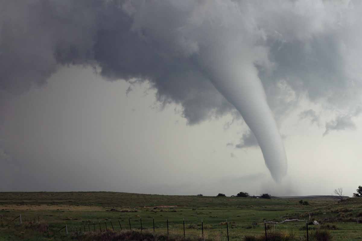 A tornado funnel cloud touches down in a Nebraska field
