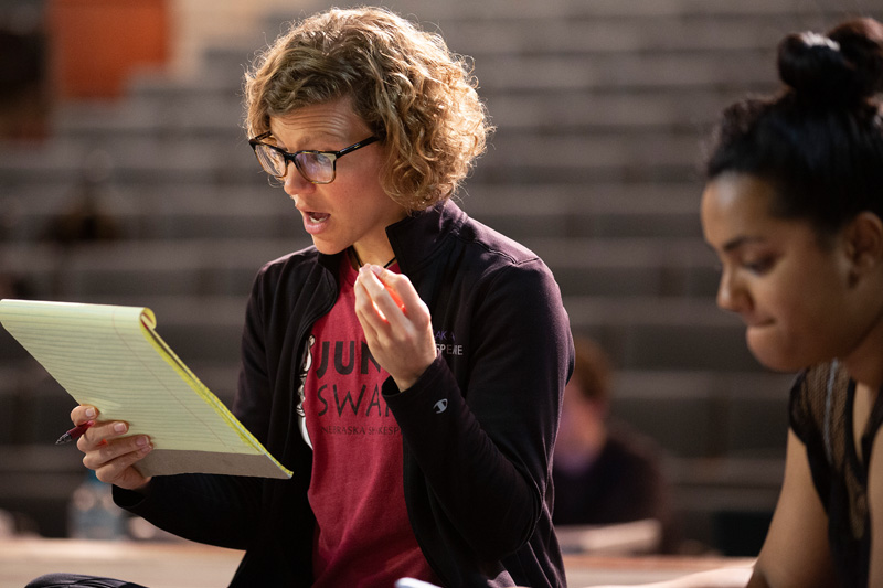 Brown goes over notes with the cast during a Nebraska Shakespeare rehearsal.