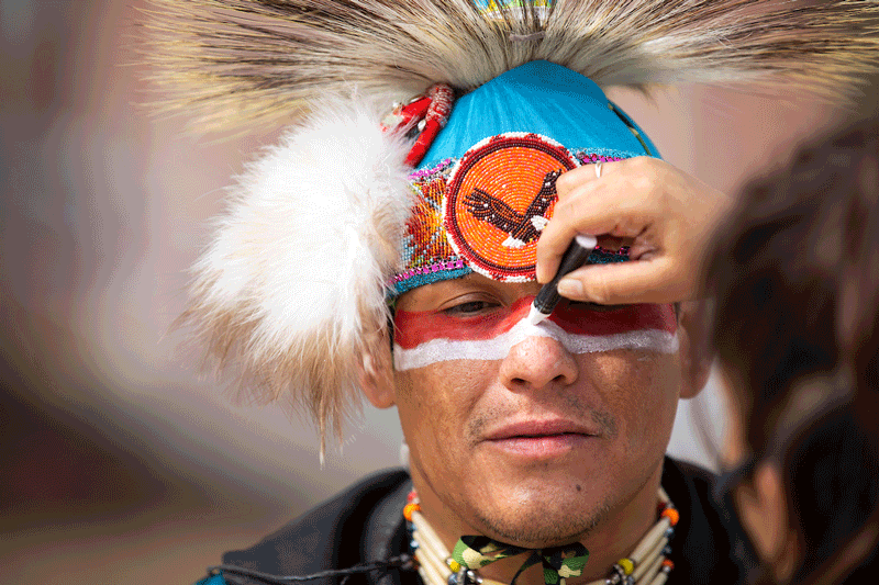 Head Man Brandon Stabler of the Omaha Tribe prepares to dance outside Arts and Sciences Hall for the virtual Wambli Sapa Memorial Powwow on campus at the University of Nebraska at Omaha in Omaha, Nebraska, Saturday, March 13, 2021.