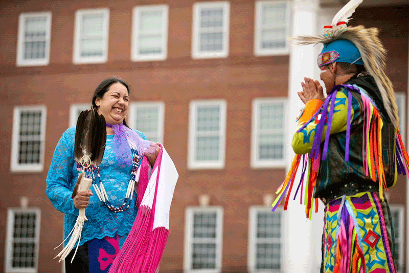 Head Woman Samantha Gallagher of the Ponca and Otoe Missoura and Head Man Brandon Stabler of the Omaha Tribe prepare to dance outside Arts and Sciences Hall for the virtual Wambli Sapa Memorial Powwow on campus at the University of Nebraska at Omaha in Omaha, Nebraska, Saturday, March 13, 2021.