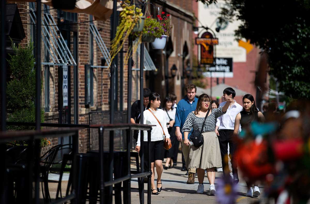 Visiting students from Japan walk through Downtown Omaha