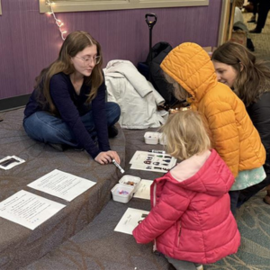 a photo of a service learning course experience with a k-12 partner