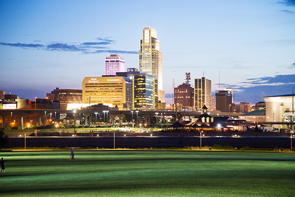 Omaha city skyline at night, brightly lit from a low angle
