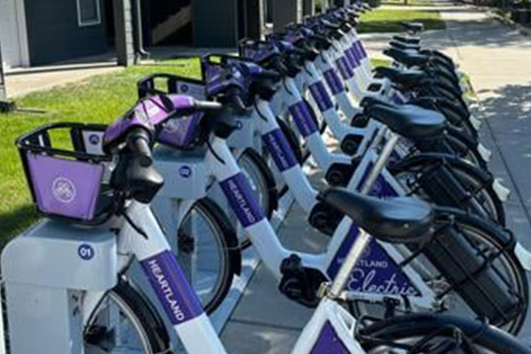 line of e-bikes standing in a heartland bike share rack