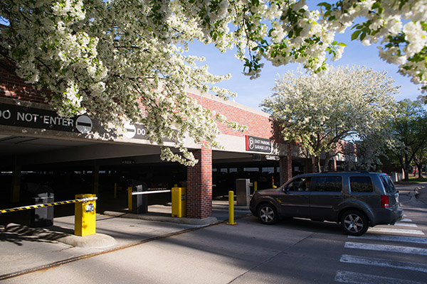 vehicle pulling into parking garage on UNO's campus