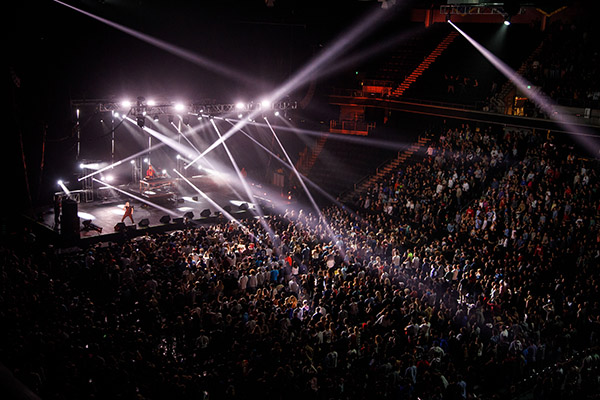 large concert crowd and stage with elaborate light show