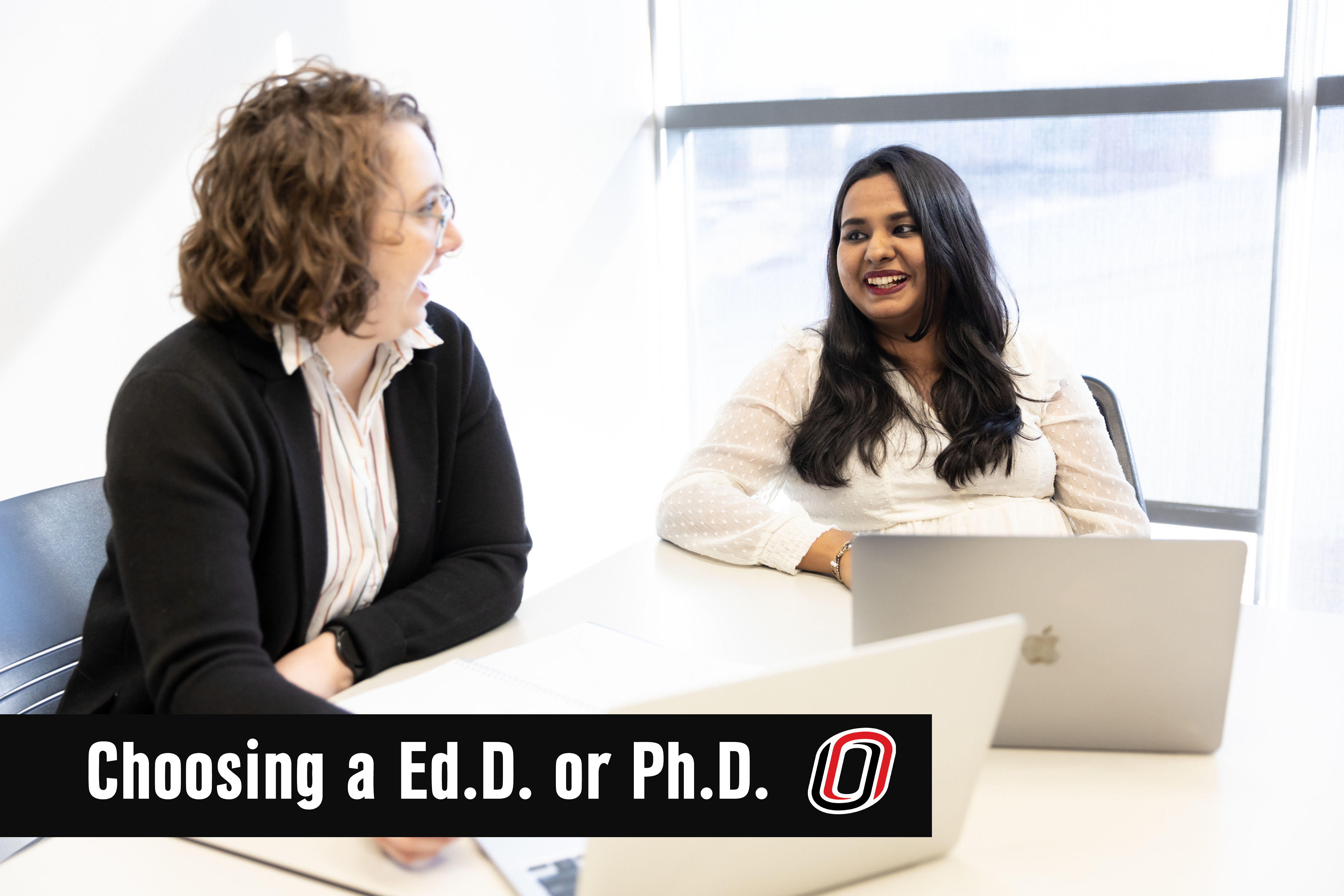 Two individuals talking, an overlay reads "Choosing an Ed.D. or Ph.D."