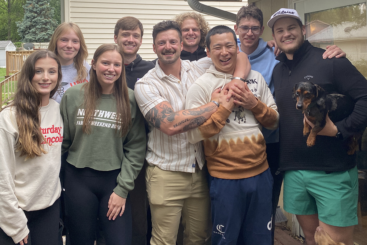 Graduate students celebrating the end of their first year at a barbecue