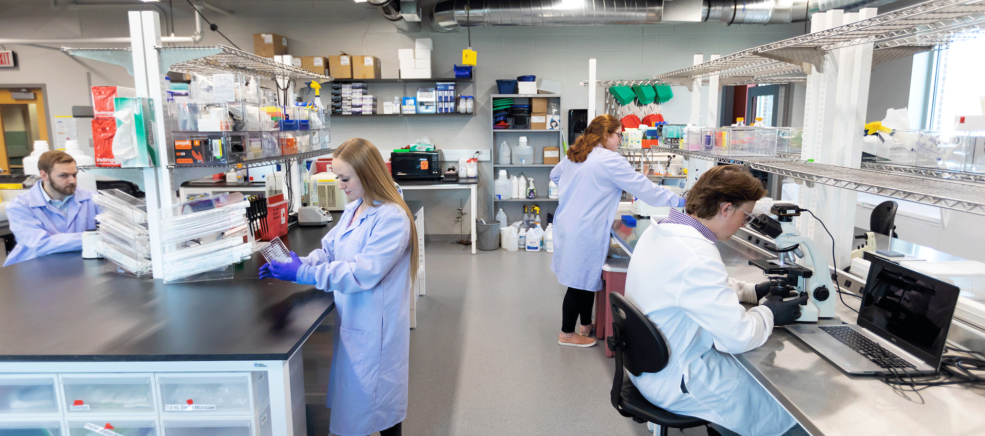 a uno student and professor work on a research project in a lab