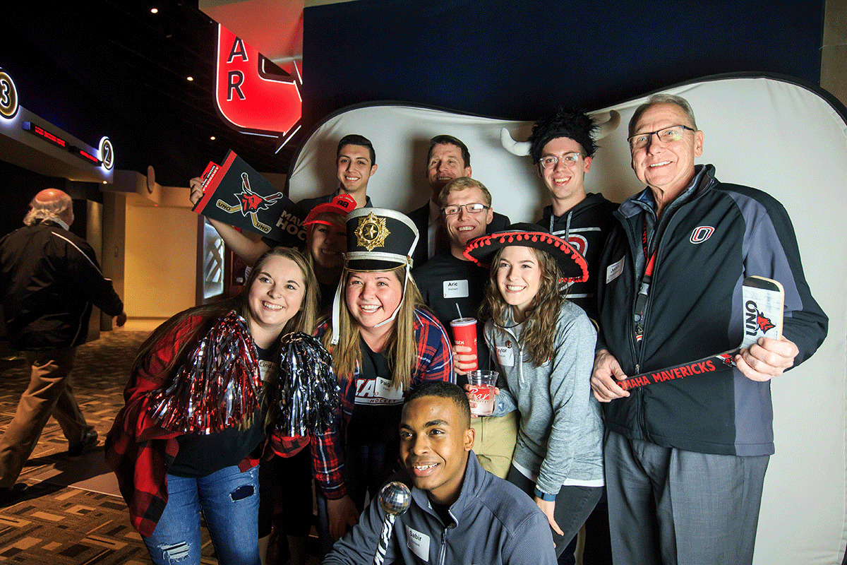 John Christensen celebrating the frozen four with uno students
