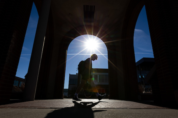 student walking on campus