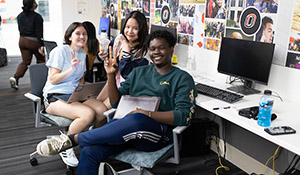 Two students sharing a table eating breakfast