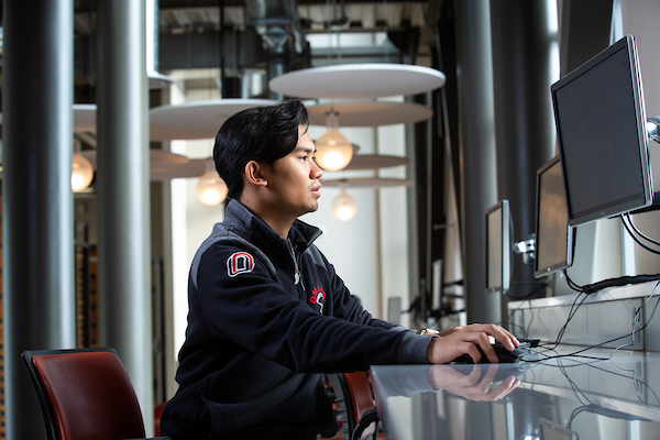 a student works on a computer in the Peter Kiewit Building at UNO.