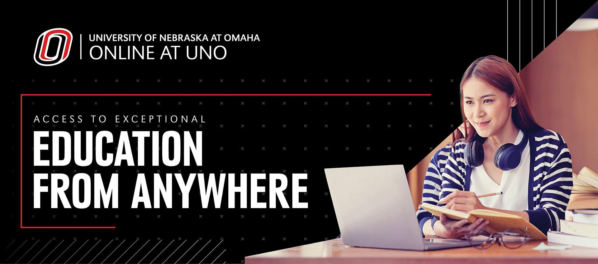 Female student sitting at laptop